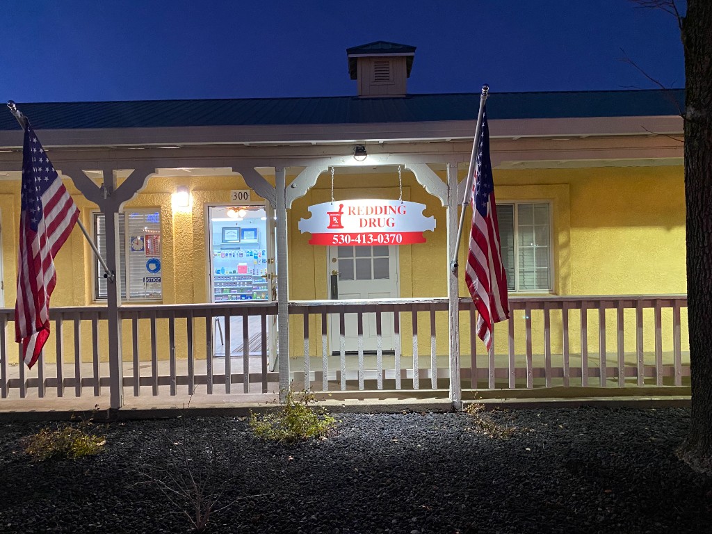 Redding Drug pharmacy storefront at night